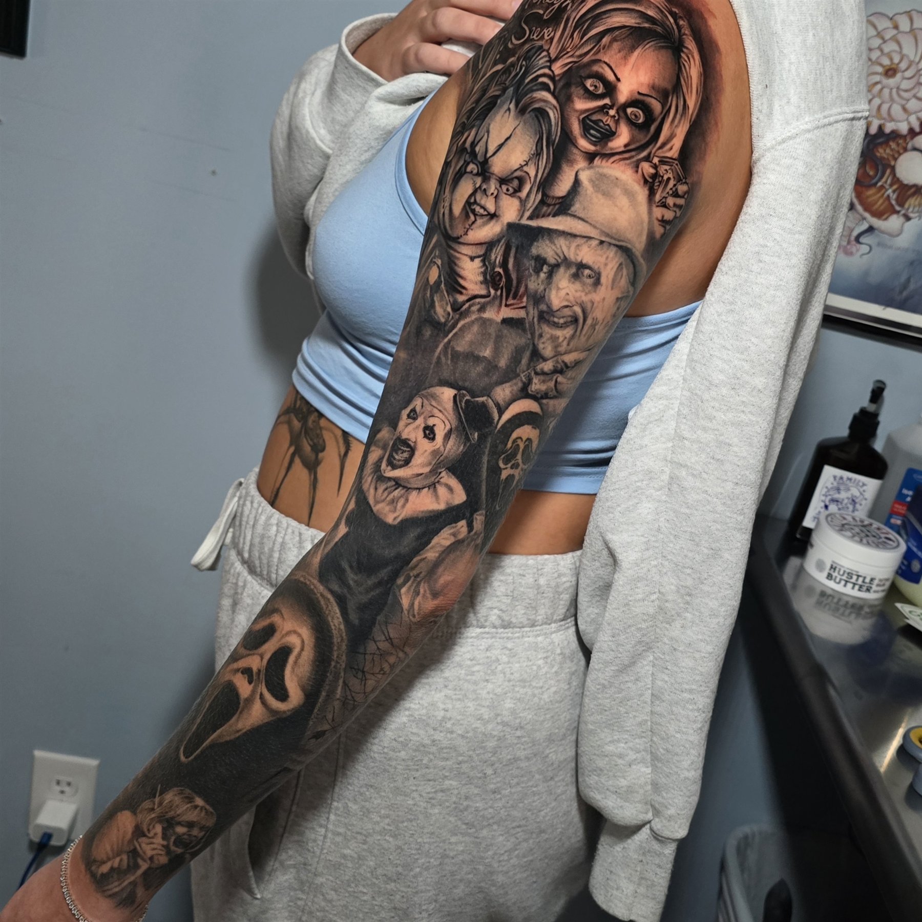Black and grey horror sleeve featuring Art the Clown, Ghostface, Chucky, and other horror icons by Billy Smith