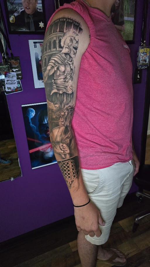 Black and grey Roman warrior full sleeve tattoo by Billy Smith